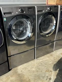 Graphite steel front load lg steam washer and front load lg steam dryer with pedestals  working perfectly with warranty extra for delivery same day de