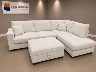 Cream comfy sectional w/ storage ottoman.
