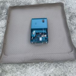 SUV Cargo Liner and Makita Drill.