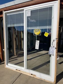 New patio door Pella size w70.3/4 h79.1/2 new construction. With blinds $876. Open from right  slide on the left inside the house $876
