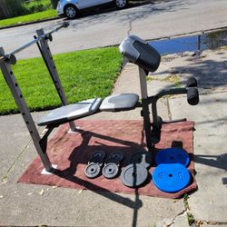 GOLDS GYM WEIGHT BENCH WITH LEG EXTENSION AND PREACHER PAD 1"HOLE  100LBs. 
2-25s  6-5s   2-10s. AND  6' BAR 
7111.S WESTERN WALGREENS 
$150. CASH ONL