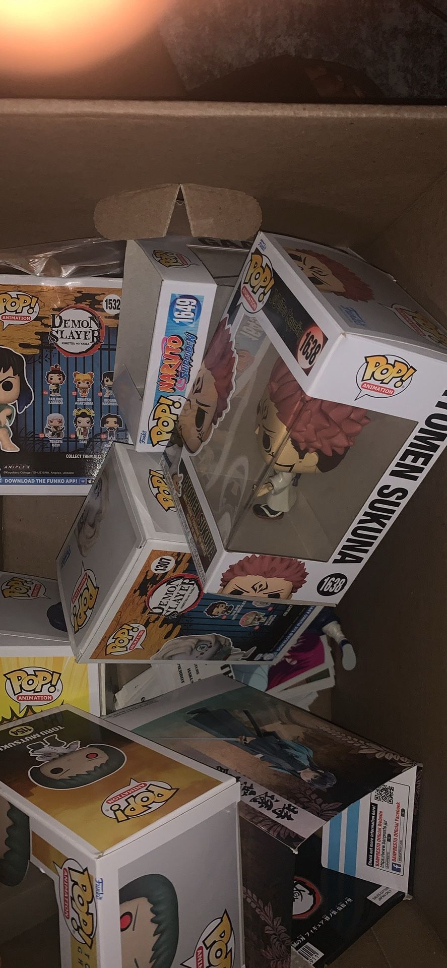 Box of funko pops and hundreds of anime cards