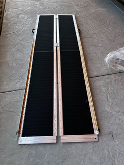 Portable multipurpose ramp is multi-fold design. Has anti-slip surface in black. Is 10 feet long and 30 inches wide. Ramp is aluminum construction wit