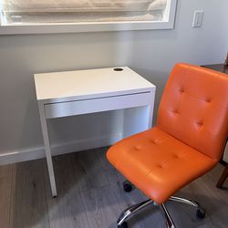 White Desk and Orange Chair
