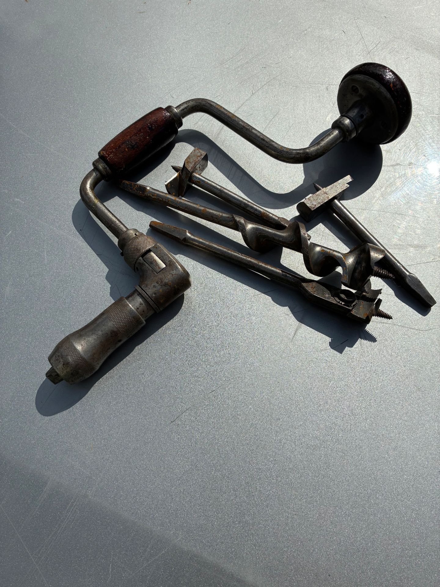 Antique hand drill with bits