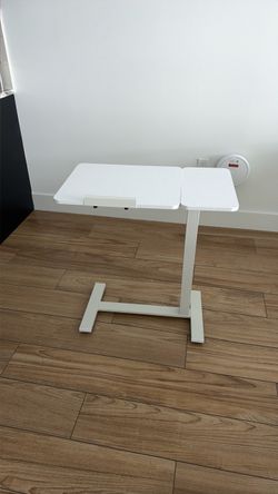 Adjustable table on wheels