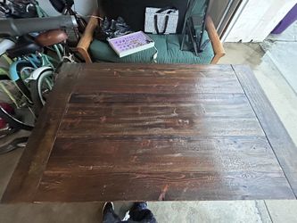 Wooden Table with white chairs