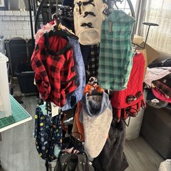 Lots Of Dog Clothes, Harness And Shoe All Sizes And New.  Also Have Harnesses, Dog Toys And Doggy Diapers.  