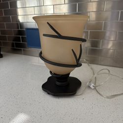 Wrought iron and amber glass table lamp