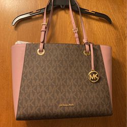 Michael Kors purse that has 1 pocket outside & 5 pockets inside/Two Tone Brown & Tan With Pink Straps & Sides 