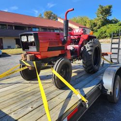 1979 International 244 Diesel Tractor And A 2023 Dual Axle Car Hauler