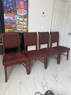 Brown and gold wooden chairs