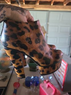 Iron Fist cheetah skull print platform booties.