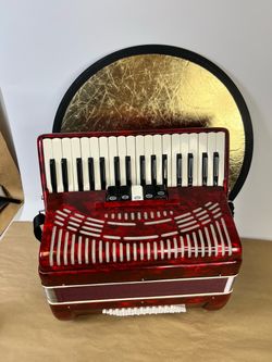 For parts or repair, right side doesn’t work - used red accordion