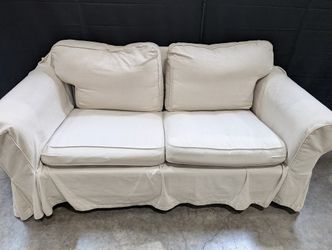 Cream Fabric Slipcovered Loveseat