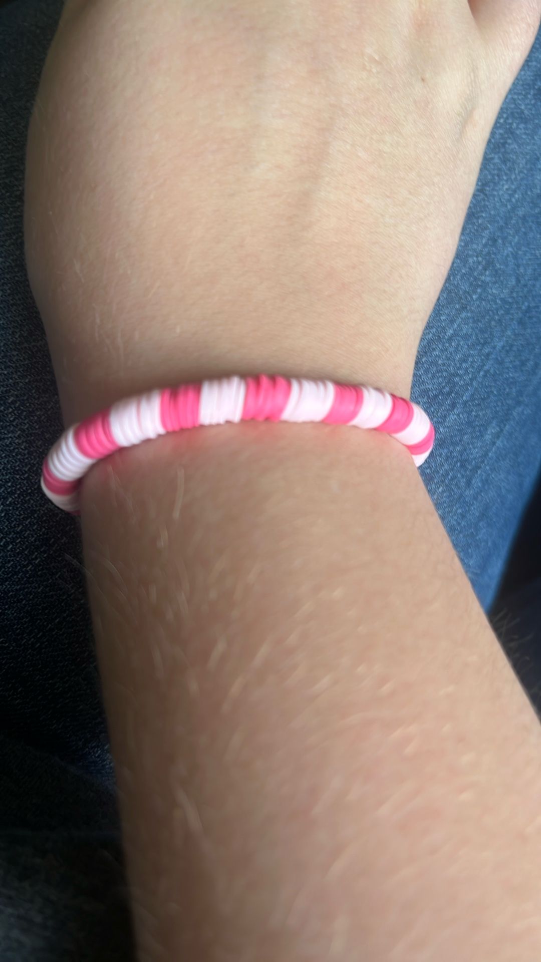 Light and dark pink bracelet made out of clay beads