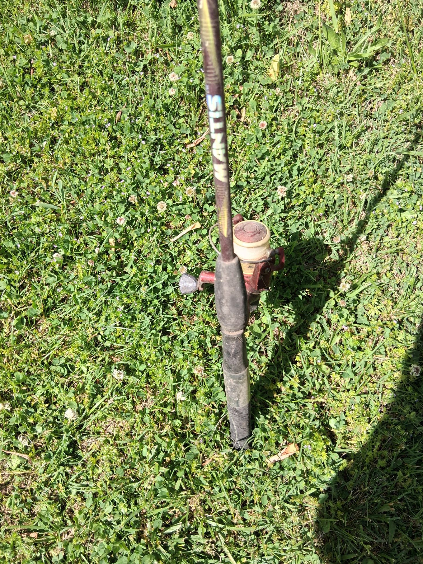 Vintage two piece mantis fiberglass rod with a Shakespeare fishing reel