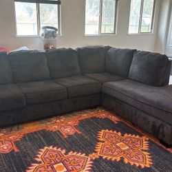 Dark Gray Sectional w/ full size mattress fold out bed