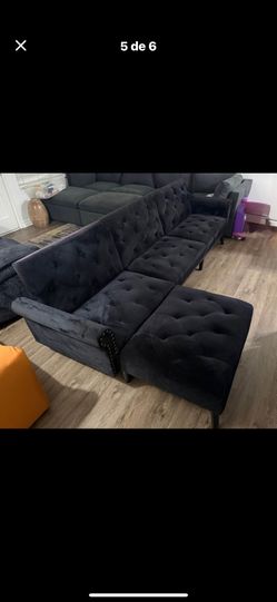 Black velvet buttoned sofa in very good condition, can be converted into a complete futon-style bed