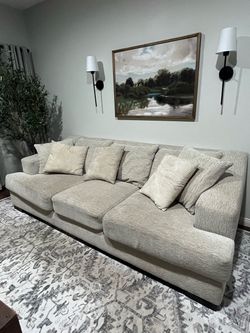 Large Beige Sectional Sofa with Cushions