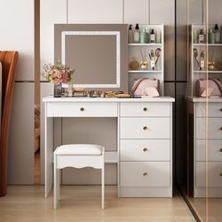 39.4-in White Makeup Vanity  This 39.4-inch wide vanity set not only has an attractive look, it also has excellent storage to ensure you're