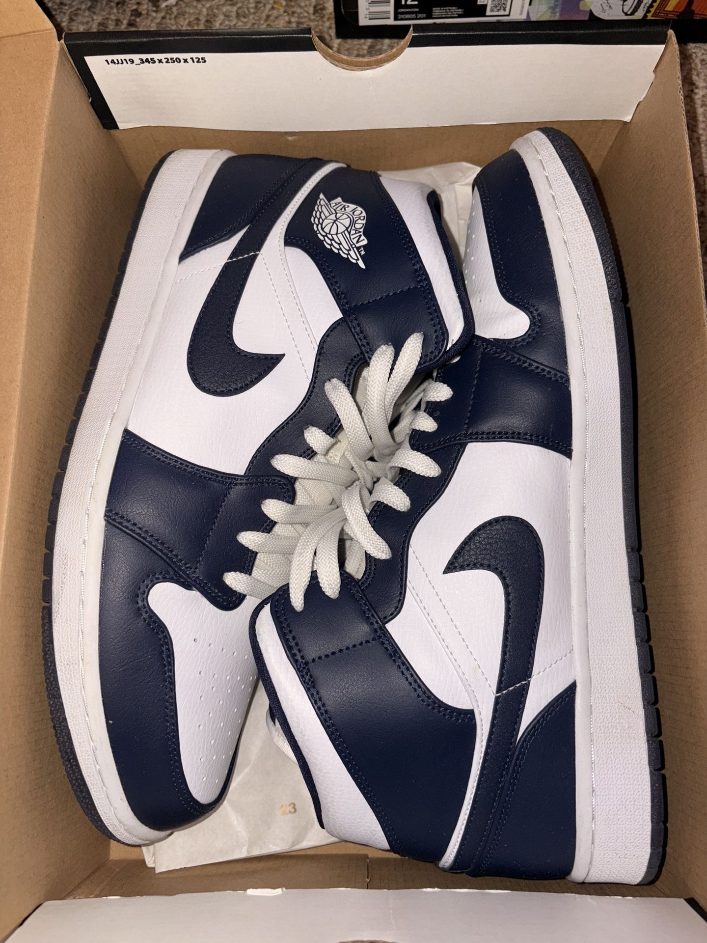 Navy/white Jordan 1 Mids 