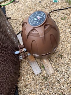 Inflatable hot tub heater and pump