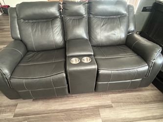 4 reclining couches with a charging outlet