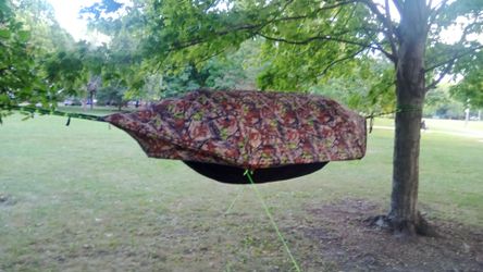 Driven low camping hammock tent with mosquito net and rainfly