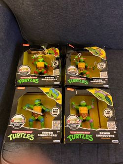TMNT 4 piece set of toy action figures. Sewer shredders.