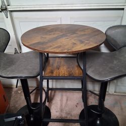 Bar top table and adjustable chairs