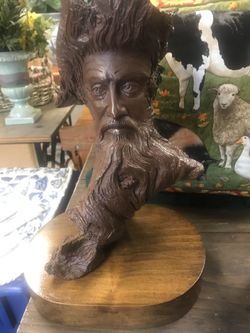 Man in Tree Statue by Rick Cain