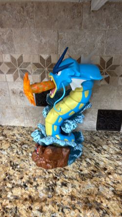 Pokémon gyarados and Pikachu statues