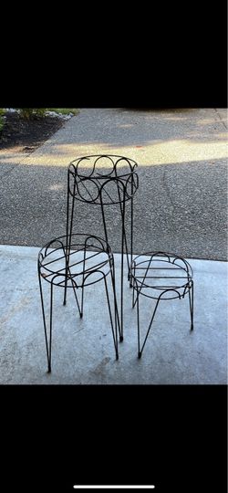 3 black metal plant stands