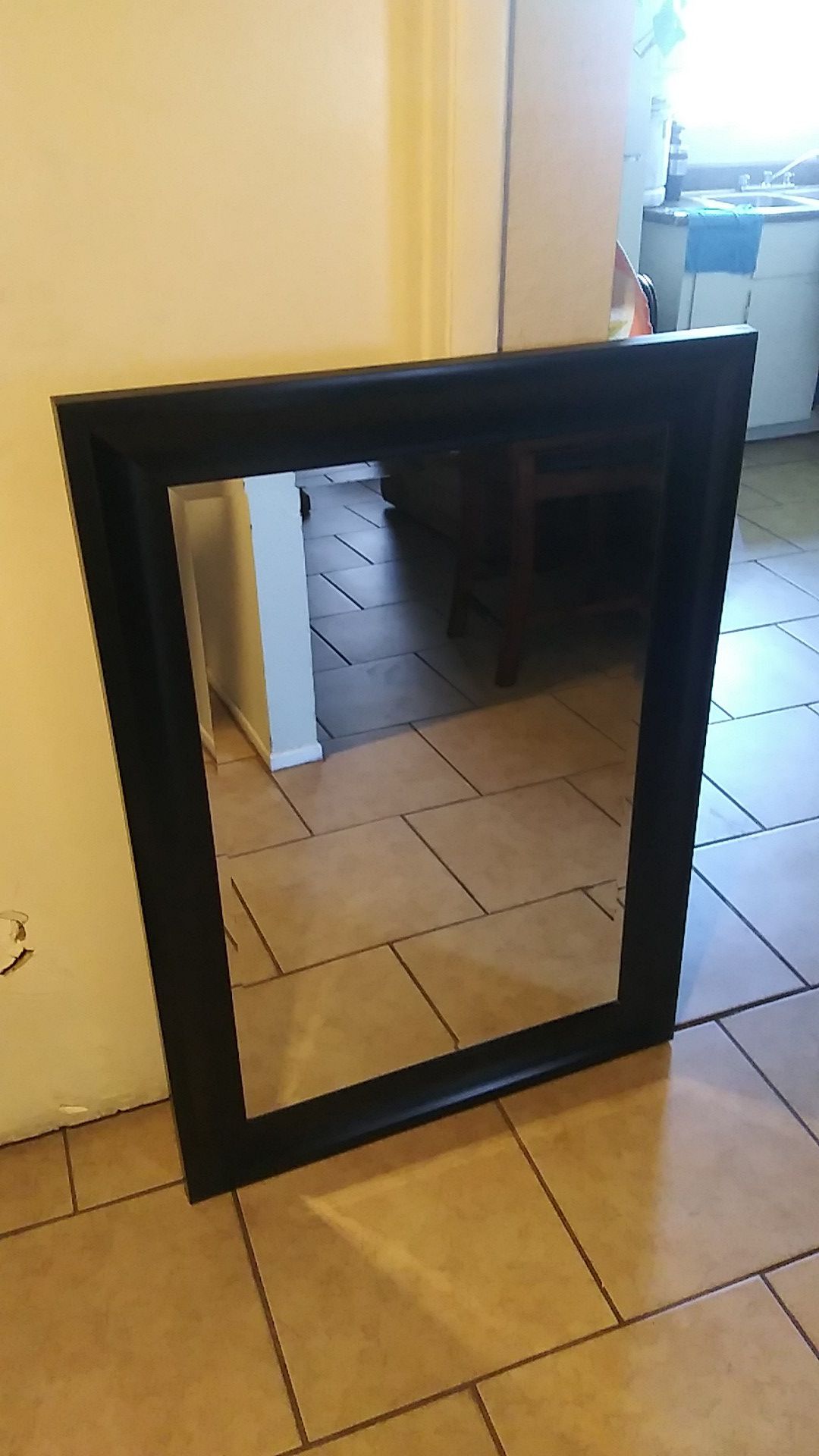 Black frame wall mirror