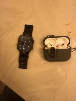 Reloj Apple Watch Ultra series 2 y unos AirPods Pro 2