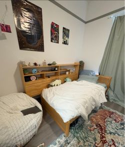 Wooden twin size bed frame with shelving