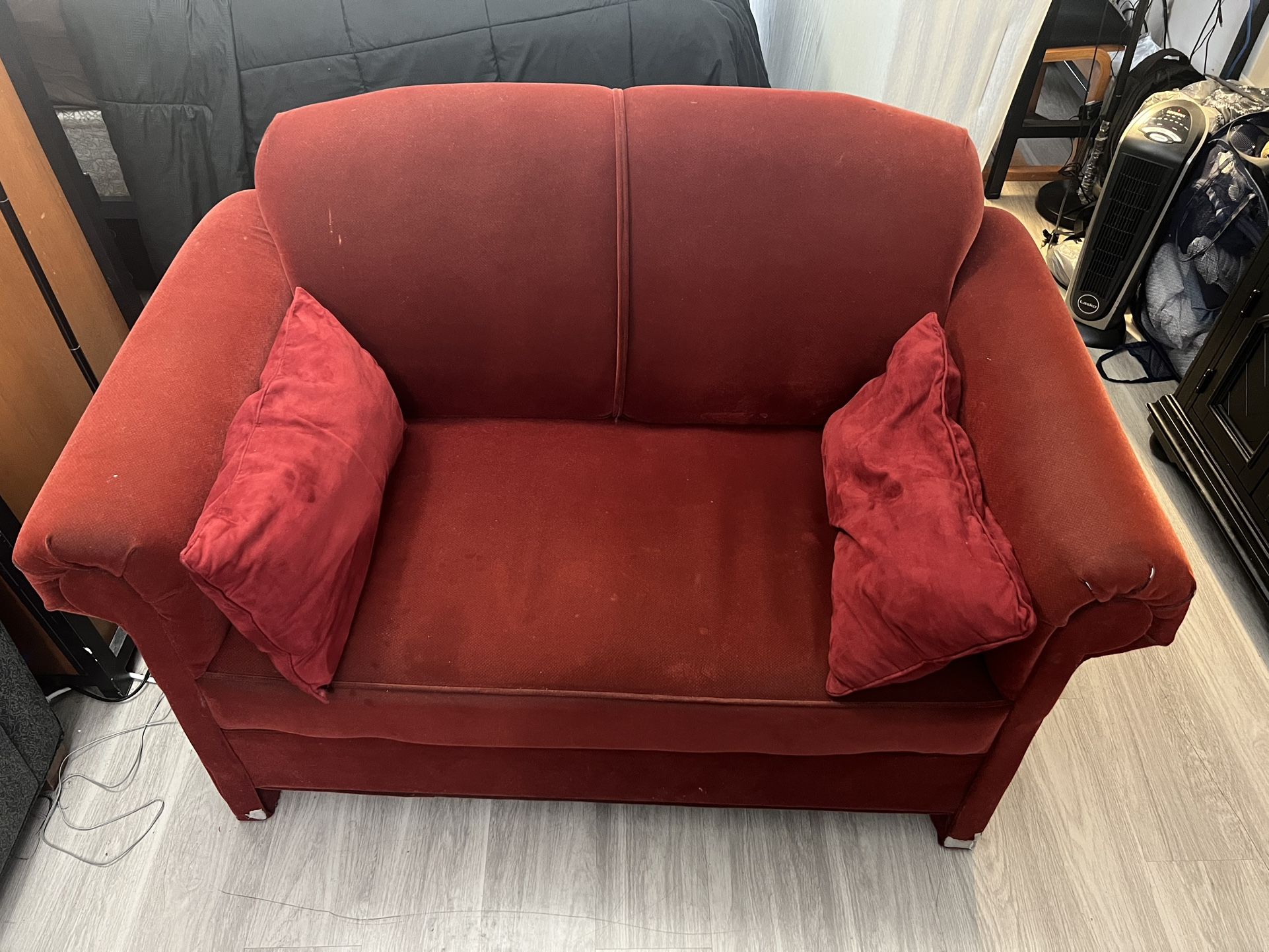 Red Loveseat with Pillows