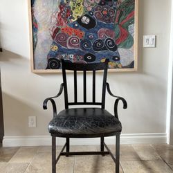 Wrought Iron Chair With Distressed Leather Seat