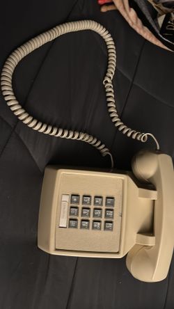 Real classic landline phone, khaki color.
