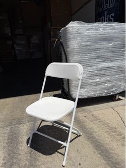 Box of 10 new white folding plastic chairs