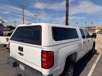 Camper shell ((2019 Silverado Short bed 6.5)) with key.