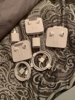 Brand new iPhone headphones with iPhone chargers and iPhone charger boxes