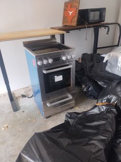 Two electric 110 plug stoves and dishwasher