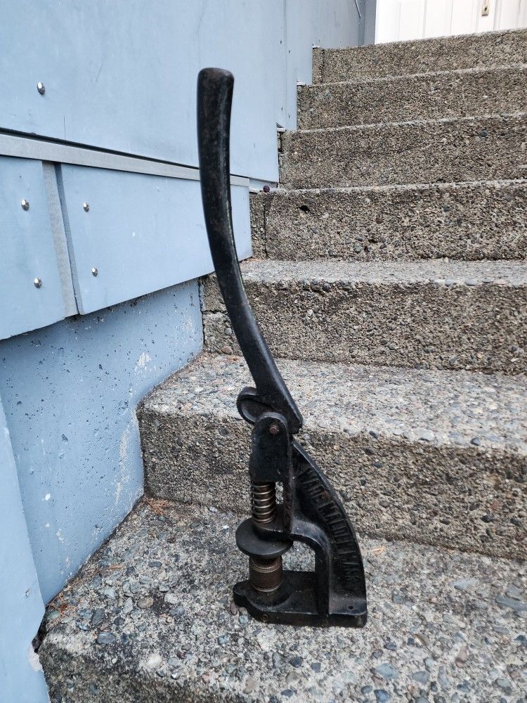 hand punch or hand press for installing eyelets/rivets.