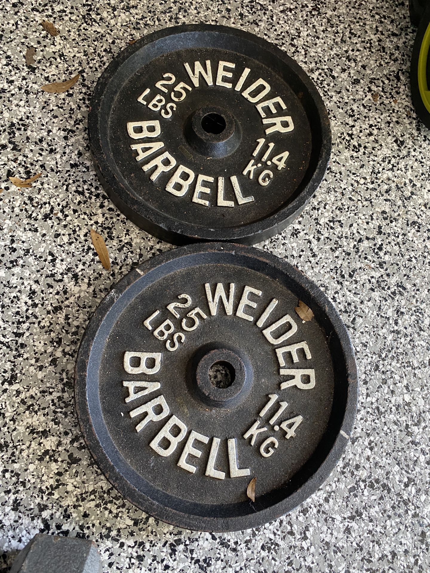 2 Barbell Plates, 25 Lb Each.