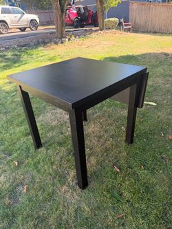 Black Square Dining Table with drop leaf.