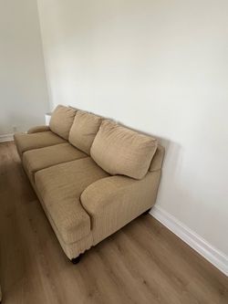 Pair of Tan Fabric Three-Seat Sofas and a 2 seat loveseat.
