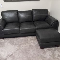 Black Leather Couch, Ottoman, 2 Pillows