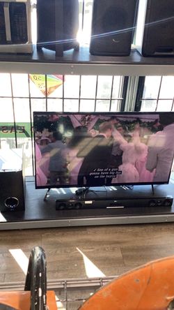 50 inch onn tv with sound bar and woofer combo